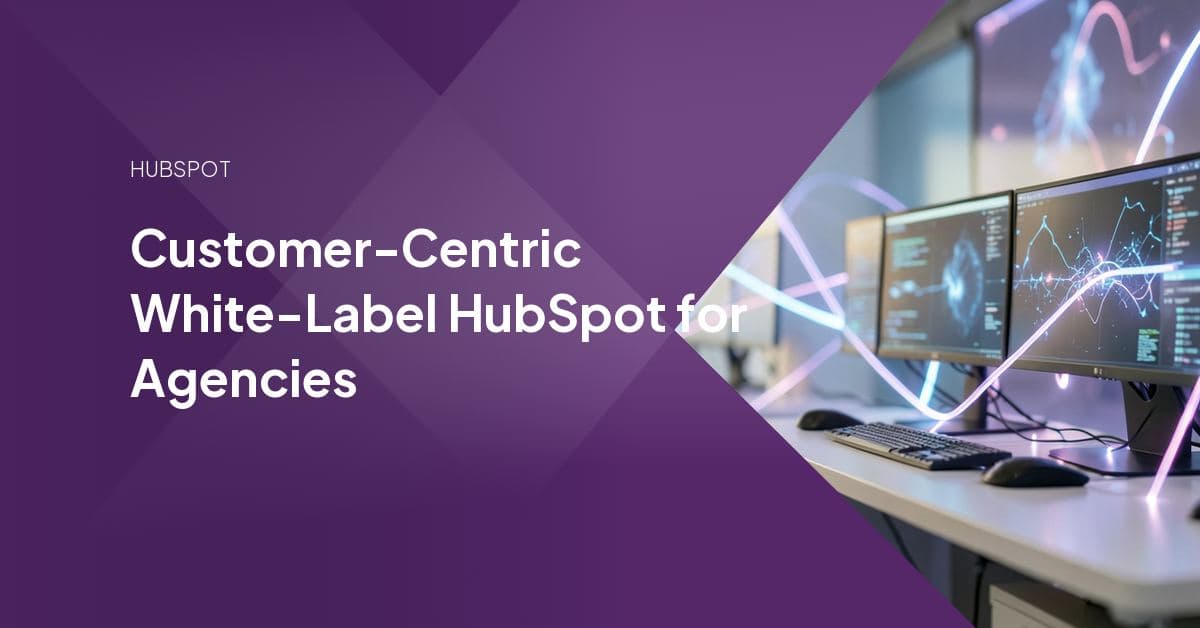 An agency team member and a white-label HubSpot specialist reviewing a branded client dashboard side by side, representing invisible delivery under the agency's own name