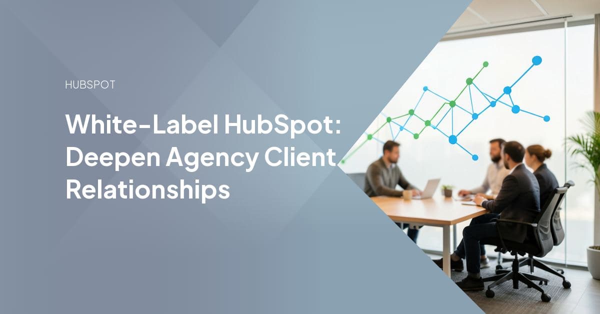 A smiling agency team member works at a desk while a colleague reviews growth charts on a whiteboard behind him, representing behind-the-scenes white-label HubSpot delivery for client-facing agencies.