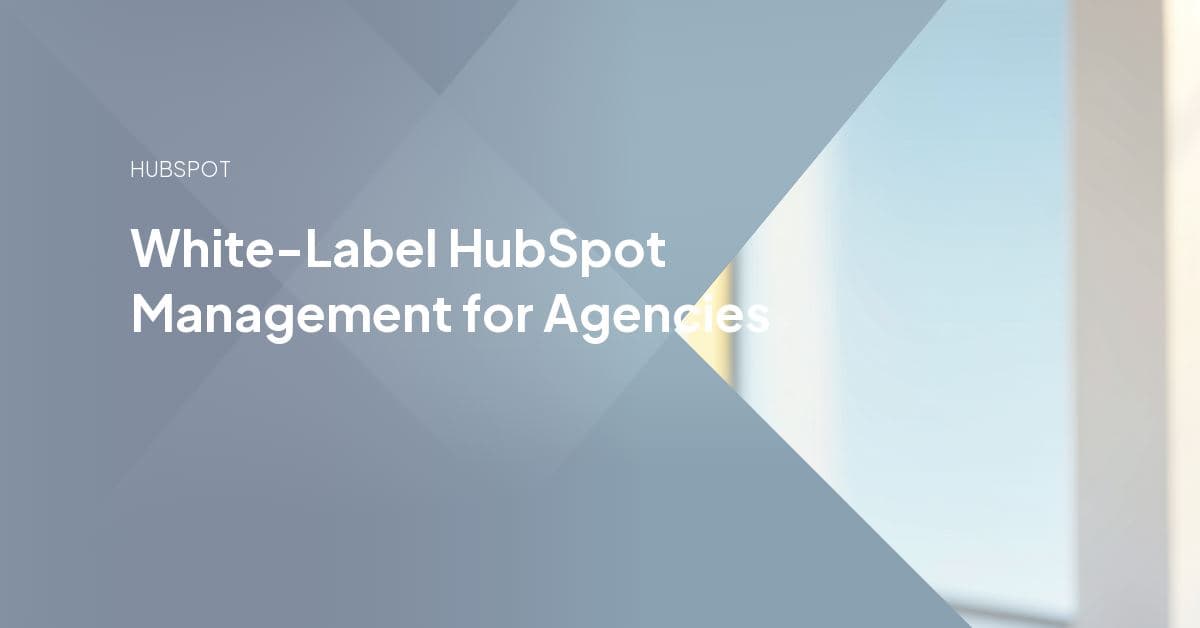 Agency team members reviewing HubSpot workflow and reporting dashboards on a laptop during a white-label delivery handoff