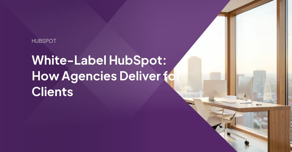 Two marketing professionals reviewing a HubSpot portal dashboard together, representing a white-label delivery partnership between agencies.